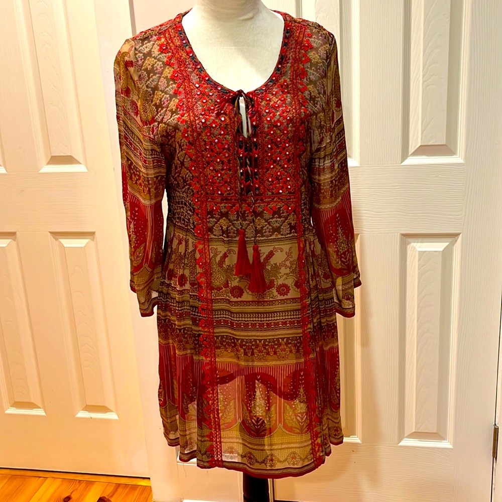 Lightweight, 3/4 sleeve dress with touching on sides and tassels on tie